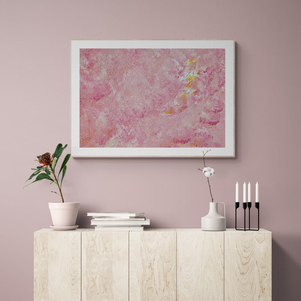 Bright pink and yellow Feel good one of one-of-a-kind colorful art poster based on original abstract art created by up-and-coming artist Scandinavian Jeanette Haga as decor in a modern home on a pink wall
