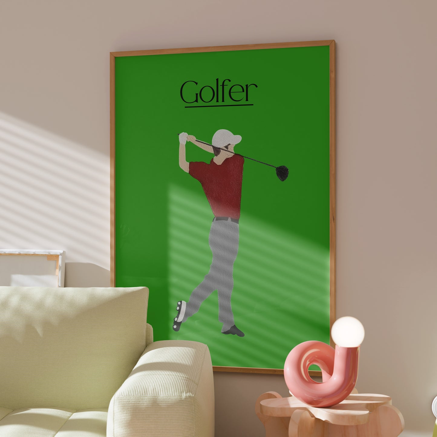 Framed Golfer Green poster displayed in a sunlit modern interior — green golf wall art made by Scandinavian up-and-coming artist Jeanette Haga.