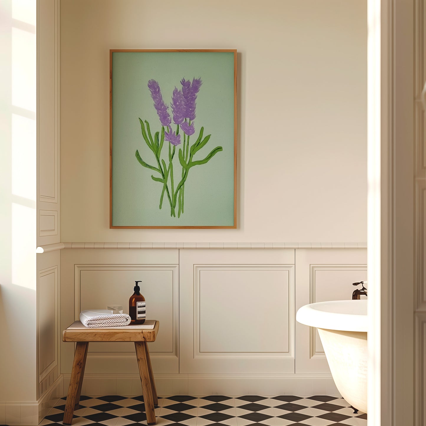A framed botanical art print of purple lavender flowers on a sage green background, hanging on a beige wall in a classic bathroom setting with a wooden stool, checkered floor, and white bathtub.