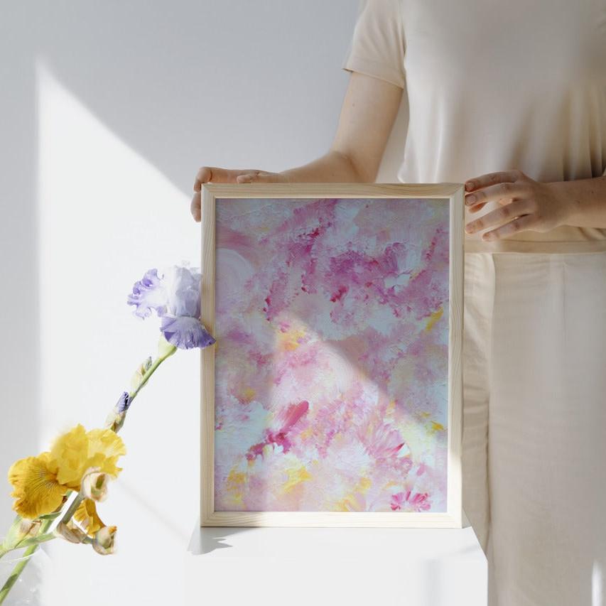 pastelpinkandyellow Feel good one of one-of-a-kind colorful art poster based on original abstract art created by up-and-coming artist Scandinavian Jeanette Haga as decor for modern homes held by a woman