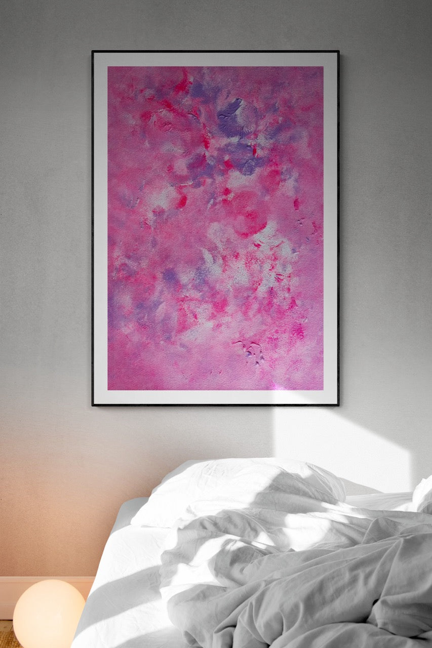 Pink, purple and white abstract art poster on a grey wall in a minimalistic bedroom with white bed sheets